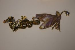 KIRKS FOLLY, TWO ENAMEL BROOCHES, A FAIRY WITH STAR AND A FAIRY RIDING A DRAGON