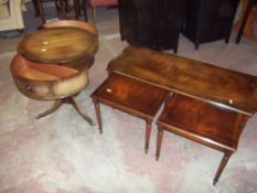 A COFFEE TABLE, NEST OF TABLES, EDWARDIAN STYLE REPRO AND A DRUM TABLE
