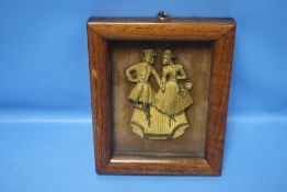 A FRAMED 19TH CENTURY BRONZED PLAQUE OF A COUPLE IN A WALNUT FRAME, INSCRIPTION TO REVERSE, THIS