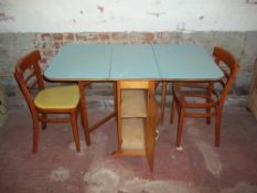 A VINTAGE RETRO FORMICA DROP LEAF KITCHEN TABLE AND TWO CHAIRS WITH STORAGE