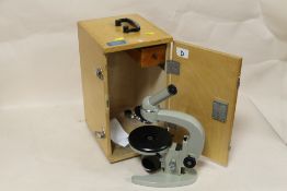 A CASED MICROSCOPE, MADE IN THE USSR