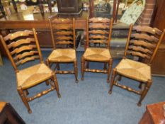A SET OF FOUR OAK WICKERSEAT DINING CHAIRS
