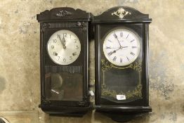 TWO WALL CLOCKS, TO INCLUDE A PLASTIC EXAMPLE