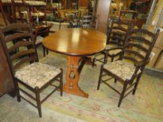 A MODERN EXTENDING DINING TABLE AND FOUR CHAIRS