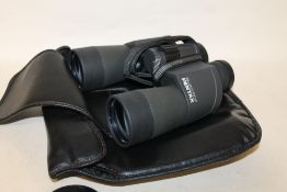 A PAIR OF PENTAX 1650 PCF BINOCULARS IN A LEATHERETTE CARRY CASE