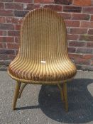 A LLOYD LOOM GOLD CHAIR