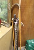 A LARGE QUANTITY OF WALKING STICKS TO INCLUDE A BONE HANDLED EXAMPLE