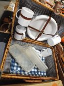 A WICKER PICNIC HAMPER AND CONTENTS