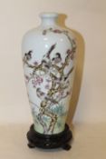 AN ORIENTAL VASE DECORATED WITH BIRDS