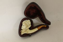 A CASED MEERSCHAUM PIPE WITH AMBER TIP
