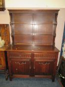 A 20TH CENTURY OAK DRESSER WITH PLATE RACK - W 126 CM