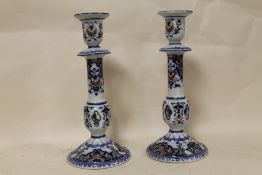 A PAIR OF CONTINENTAL CERAMIC CANDLESTICKS