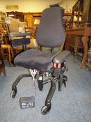 AN ELECTRIC INVALID ARMCHAIR