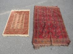TWO SMALL ANTIQUE EASTERN RUGS LARGEST 157 X 97 CM SMALLEST 98 X 68 CM