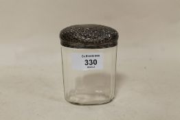 A SILVER TOPPED JAR