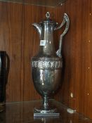 A SILVER PLATED CLARET JUG