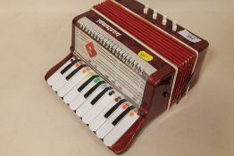 A SMALL NOVELTY BONTEMPI ACCORDION