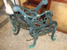 TWO PAIRS OF GREEN PAINTED CAST METAL BENCH ENDS WITH LION DETAIL