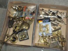 TWO TRAYS OF BRASSWARE, CONSISTING OF DOOR HANDLES, DRAWER HANDLES ETC.