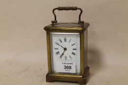 A SMALL CARRIAGE CLOCK
