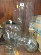 AN UNUSUAL GLASS MODEL OF A HEAD, LARGE GLASS VASE AND A DECANTER (3)