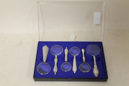 A BOXED MAGNIFYING SET