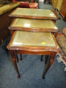 A MODERN GLASS TOPPED NEST OF TABLES