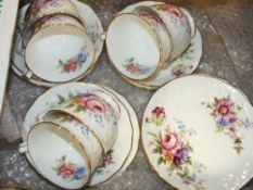 A SET OF SIX FLORAL AYNSLEY CHINA TRIOS