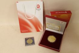A BEIJING 2008 '100 DAYS TO GO' CASED OLYMPIC COIN TOGETHER WITH A MOSCOW OLYMPIC 1980 PYE COIN