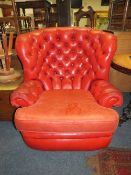 A VINTAGE RED LEATHER ? ARMCHAIR