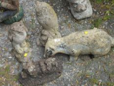 FOUR STONE GARDEN ORNAMENT TO INCLUDE OWLS BADGER ETC - A/F
