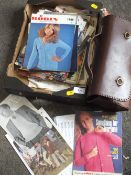 A LEATHER SATCHEL CONTAINING KNITTING NEEDLES TOGETHER WITH A TRAY OF PATTERNS