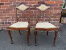 A PAIR OF EDWARDIAN MAHOGANY UPHOLSTERED BEDROOM CHAIRS