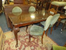 A REPRODUCTION WALNUT DINING TABLE WITH GLASS TOP AND FOUR CHAIRS A/F