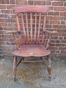 A TRADITIONAL ELM WINDSOR ARMCHAIR