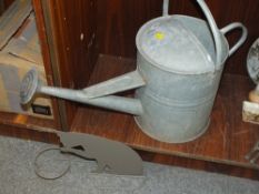 A VINTAGE GALVANISED WATERING CAN TOGETHER WITH A CAT DESIGN PLANT POT HOLDER (2)