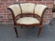 AN EARLY 20TH C MAHOGANY AND UPHOLSTERED TUB STYLE CHAIR