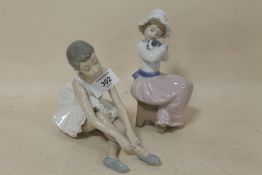 A NEO FIGURE OF A BALLERINA TOGETHER WITH A FIGURE OF A GIRL WITH A PUPPY