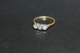 A HALLMARKED 18 CARAT GOLD DIAMOND TRILOGY RING, approx weight 2.8g, ring size N