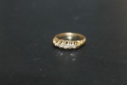 A HALLMARKED 18 CARAT GOLD FIVE STONE DIAMOND RING, approx weight 3g, ring size L