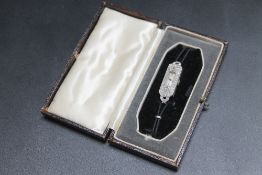 A DIAMOND SET ART DECO STYLE COCKTAIL WATCH, on leather strap, H 3.5 cm