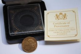 A CASED VICTORIAN 1871 GOLD SOVEREIGN