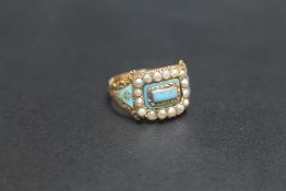 A GEORGIAN GOLD ENAMEL AND SEED PEARL MOURNING RING, central enamel panel is detachable, ring