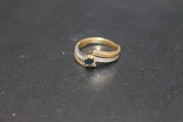 A SAPPHIRE AND DIAMOND RING, stamped 750, approx weight 4.4g, ring size N