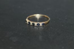 A HALLMARKED 9 CARAT GOLD SEVEN STONE SAPPHIRE AND DIAMOND RING, approx weight 1.7g, ring size V