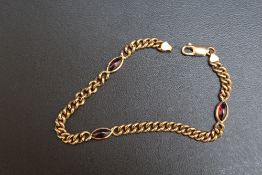 A 9C GOLD BRACELET INSET WITH THREE CABOCHONS, approx weight 9.4g, L 18.5 cm