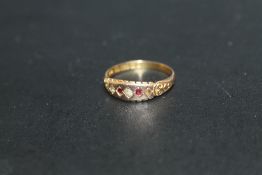 A HALLMARKED 15 CARAT RUBY AND DIAMOND RING, approx weight 2.1g, ring size P