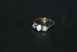 AN OPAL AND DIAMOND THREE STONE RING, marks indistinct, approx weight 3g, ring size N 1/2