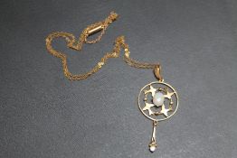 A HALLMARKED 9 CARAT GOLD EDWARDIAN STYLE OPAL SET PENDANT, set on a thin unmarked and untested