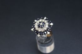 AN 18CT SAPPHIRE AND DIAMOND CLUSTER RING, approx weight 10.7g, ring size I